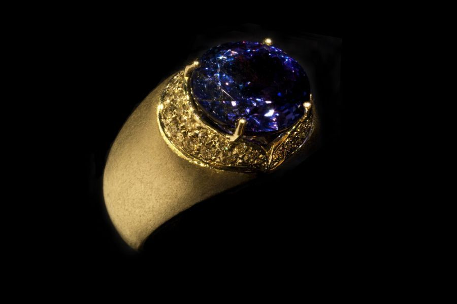 Ring with a blue diamond